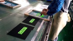 Screen print pigmented silicone ink on fabric
